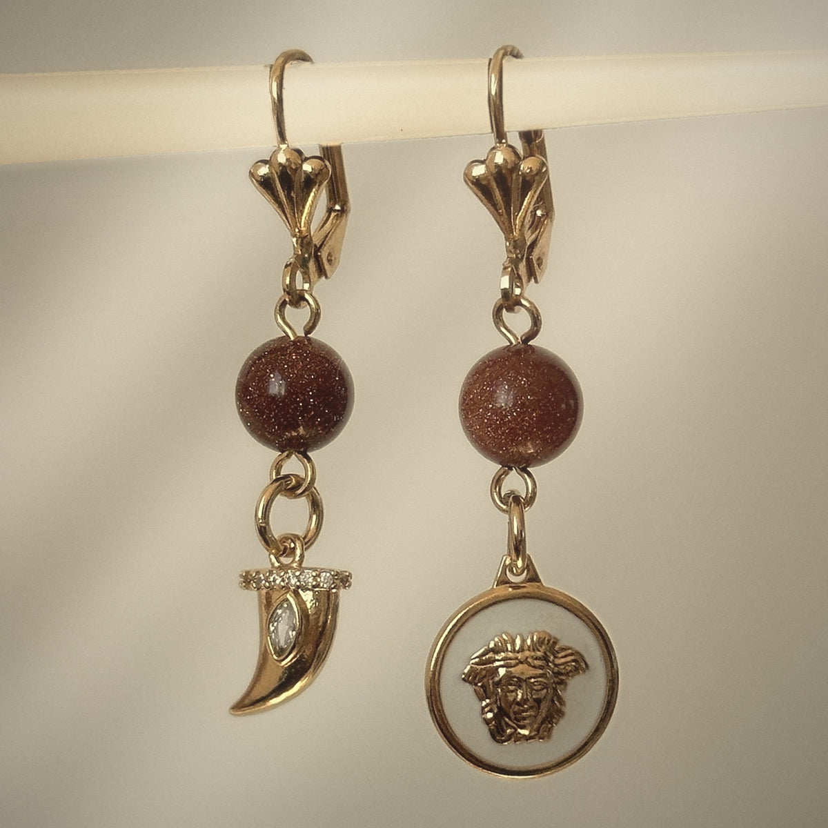 Medusa's Alchemy Asymmetrical Earrings, horn and Medusa coin drops